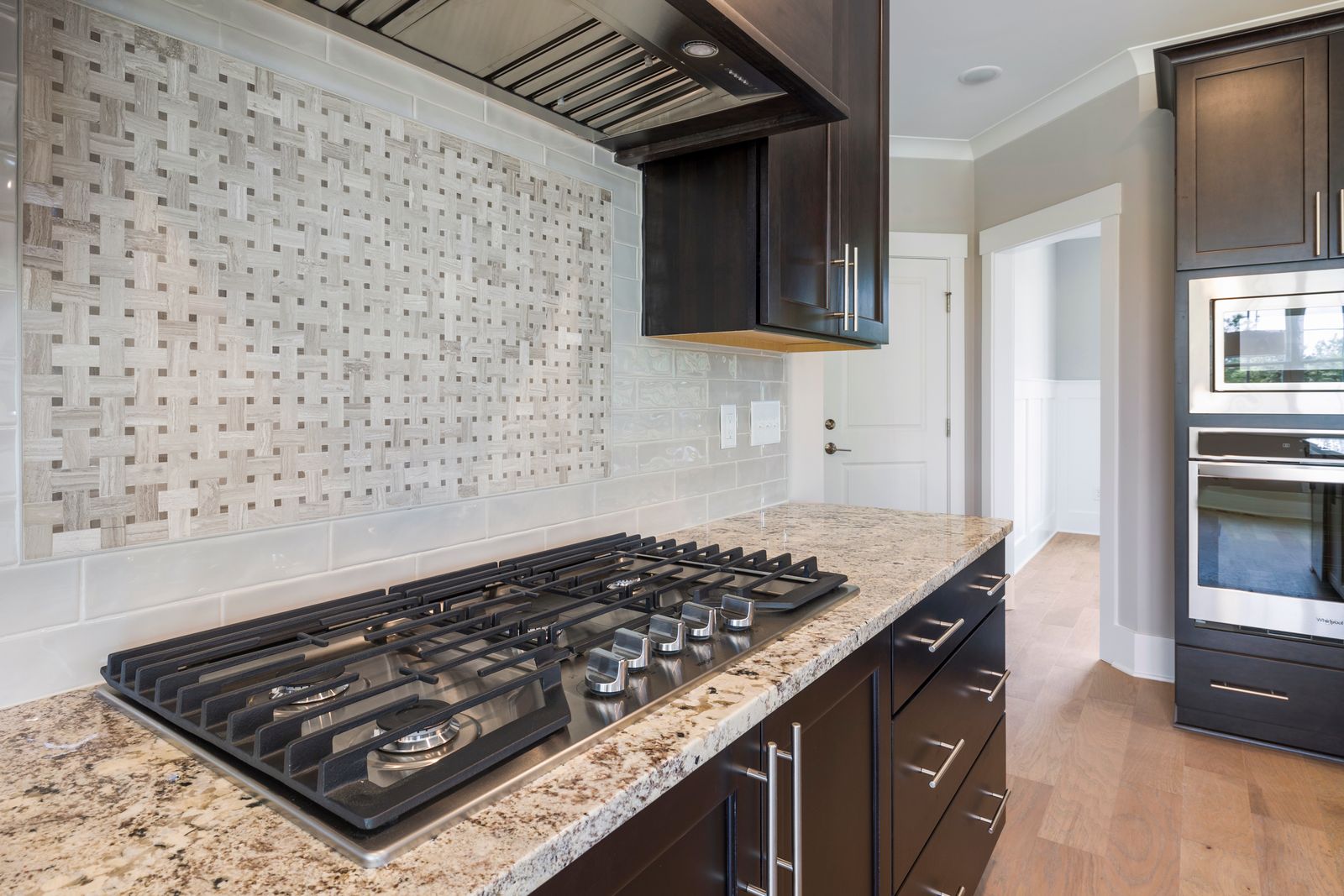 Kitchen with granite countertop and custom cabinets